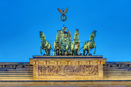 Detail of the Quadriga on top of the famous Brandenburg Gate in Berlin at nightの写真素材