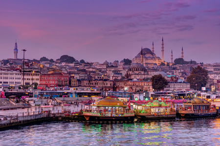 ISTANBUL, TURKEY - OCTOBER 20, 2015: Fisher boats and mosque in Eminonu District at dawnのeditorial素材