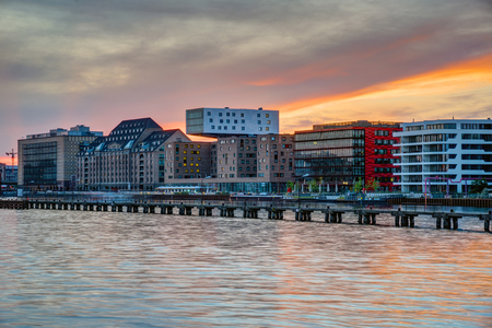 Sunset at the river Spree in Berlin with modern office buildings at the riverbankの写真素材