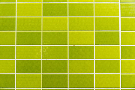A green tiled background with Relatively small tilesの写真素材