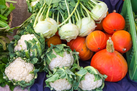 Cauliflower, celery and pumpkin for sale at a marketの写真素材