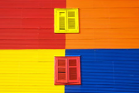 Colorful wall with two windows in La Boca, Buenos Airesの写真素材