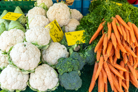 Cauliflower, broccoli and carrots for sale at marketの写真素材