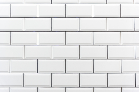 Background from a white tiled wallの写真素材