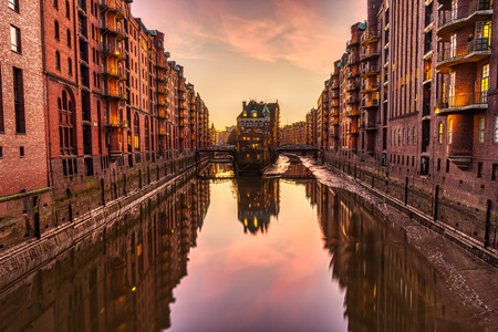 The red warehouses in the warehouse district in Hamburg at sunsetの写真素材
