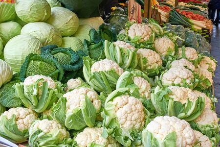 Cauliflower and cabbage for sale at a marketの写真素材