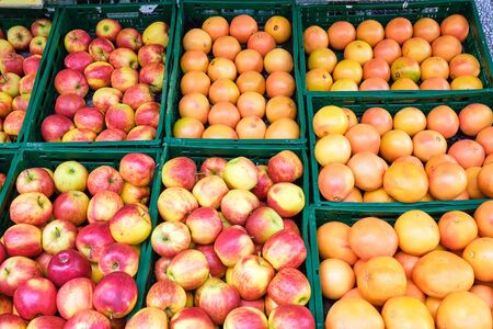 Apple, orange and grapefruit for sale at a marketの写真素材