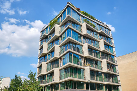 Modern apartment building with floor-to-ceiling windows in Berlin, Germany