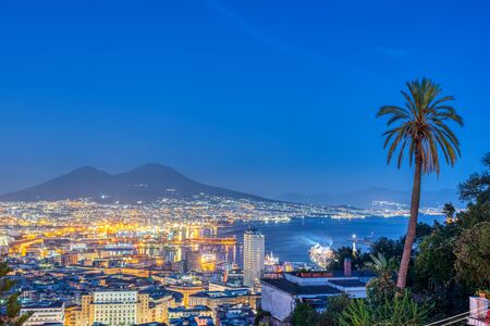 Naples in Italy with Mount Vesuvius at dusk seen from Vomero hillの写真素材