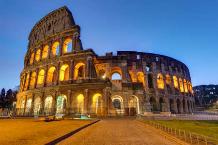 The famous Colosseum in Rome illuminated at twilightの写真素材