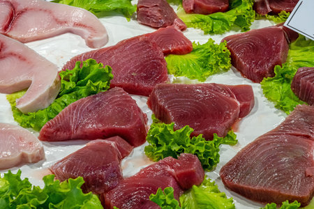 Fresh tuna steaks for sale at a marketの写真素材
