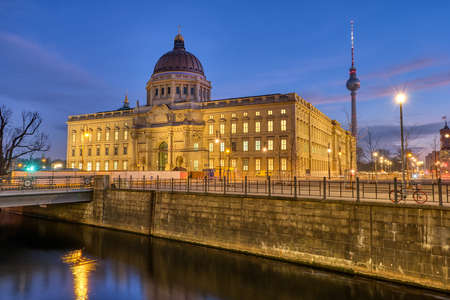 The imposing rebuilt Berlin City Palace with the Television Tower at dawnのeditorial素材