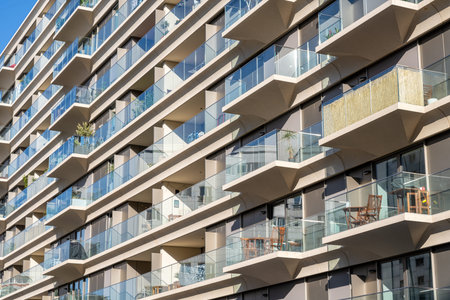 Facade of a modern apartment building with a lot of glass seen in Berlin, Germany