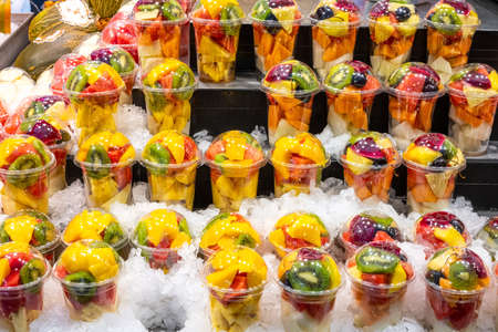 A variety of fruit salads at a market in Barcelona, Spainの写真素材