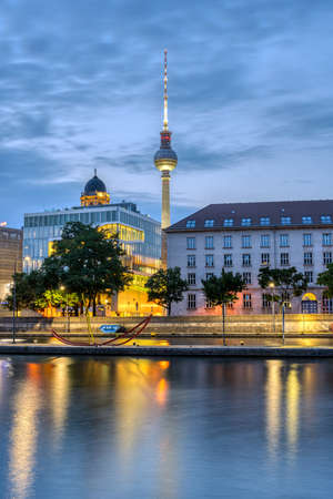 The river Spree in downtown Berlin with the famous TV Tower before sunriseの写真素材
