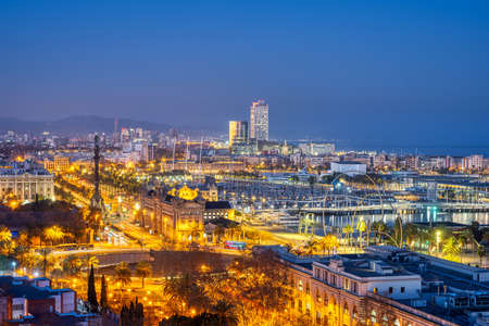 View of Barcelona with the Columbus Statue from Montjuic mountain at nightのeditorial素材