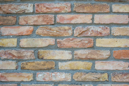 Background from a beige and orange brick wall