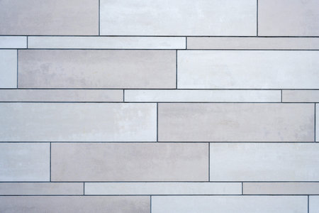 Background from a wall made of gray ceramic slabs