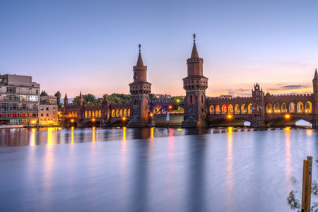 The Oberbaum Bridge across the river Spree in Berlin after sunsetの写真素材