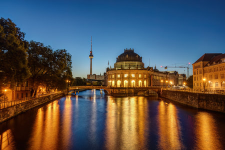 The Bode Museum in Berlin at twilight with the famous TV Tower in the backの写真素材