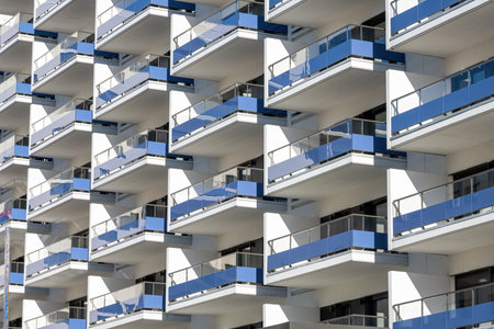 Facade of a modern residential building in Badalona, Spain, with many balconiesの写真素材