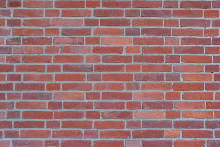 Background from a wall made of clean red clinker bricksの写真素材