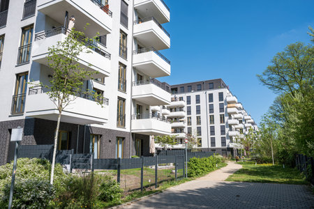 White multi-family residential buildings seen in Berlin, Germanyの写真素材