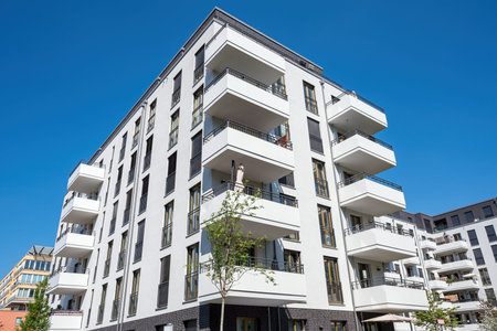 White multi-family residential building seen in Berlin, Germany