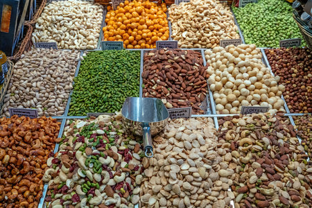 Different kinds of nuts and dried fruits seen at a market in Barcelona, Spainの写真素材