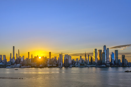The skyline of Midtown Manhattan in New York at sunrise seen from Weehawken, New Jerseyの写真素材