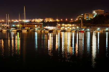 View of Termoli harbor by night (little city on the Adriatic sea in Italy)の写真素材