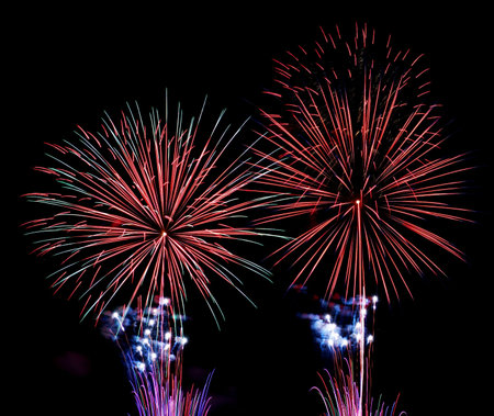 Colorful fireworks over black background