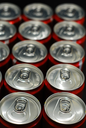 Group of tin drinks on black background