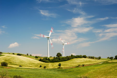 Modern and ecologic wind turbines with blue sky in summertime