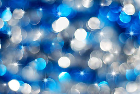 Christmas silver and blue lights background with little starsの写真素材