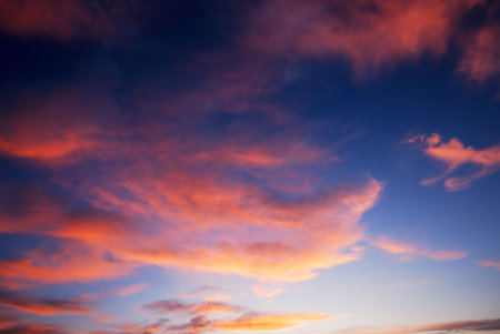 Dark red sunset clouds and deep blue sky