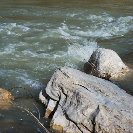 Water flowing among large stones