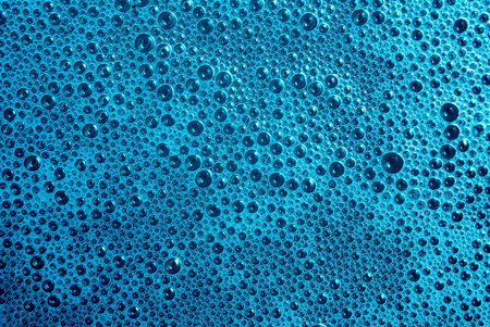 Fresh turquoise background with soap bubbles
