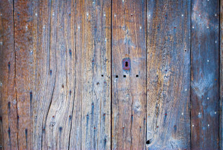 Old wooden door and nailsの写真素材