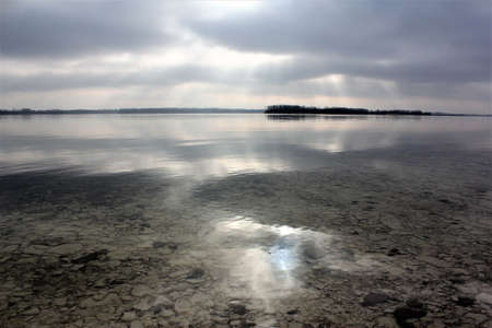 water, stone, lake, river, rock, pebble, transparent, bottom, surface, underwater, abstract, beam, below, blue, gray, light, liquid, nature, projection, reflection, shade,の写真素材