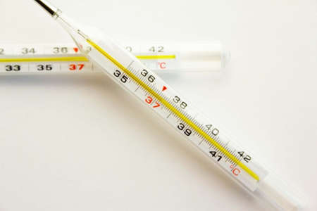 medical device, mercury thermometer for measuring temperature on a white backgroundの写真素材