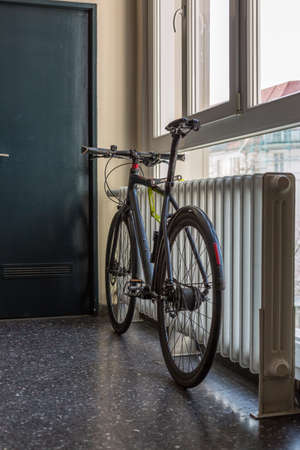 bicycle in font of windowの写真素材
