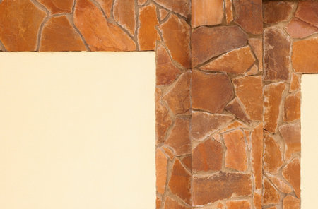 yellow stone wall with plaster