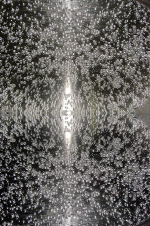 A water drop texture image good for backgrounds, borders, or texturesの写真素材