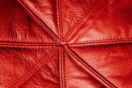 background with red leather texture. Close up of a sofaの写真素材