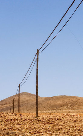  old telephone poles and wires in intense colors. Vertical imageの写真素材