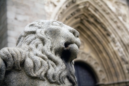 Close-up of the lion sculpture in front of the Cathedral of Avila, Spain.の写真素材