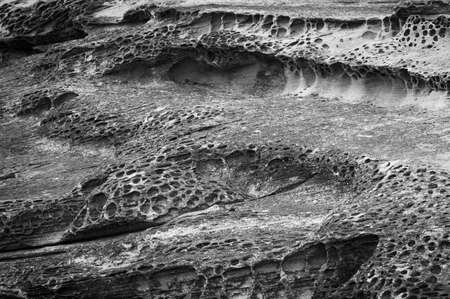 Black and white image of erosion and rock formationの写真素材