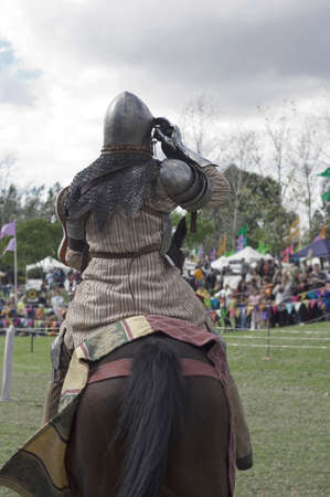 A horseman dressed as a medieval knight at a jousting competition.の写真素材