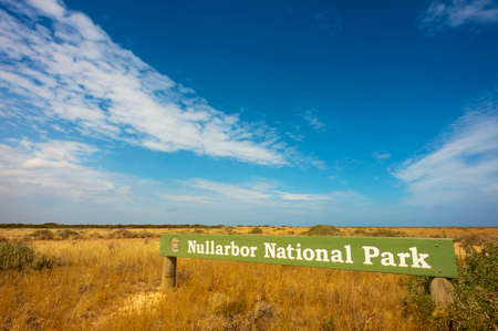 The Nullarbor National Park sign underneath a sweeping sky.の写真素材